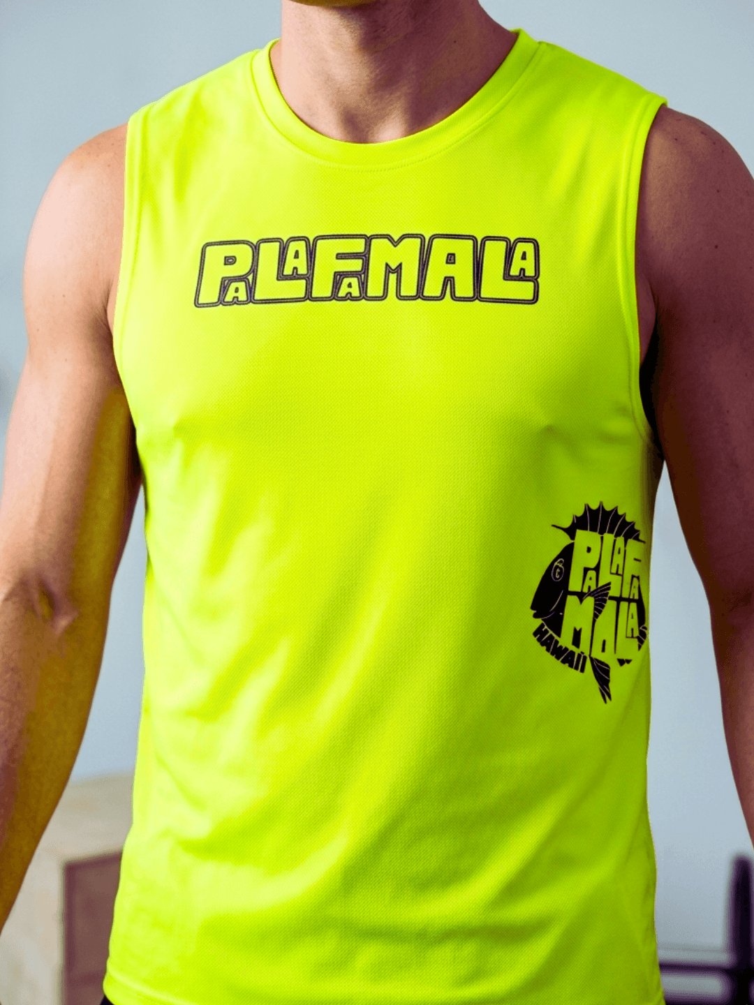 Person wearing a bright yellow sleeveless shirt with 'PALAFAMALA' branding.